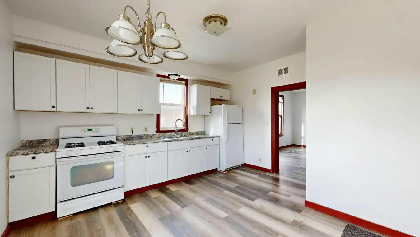 Freshly painted white kitchen cabinets with a smooth enamel finish